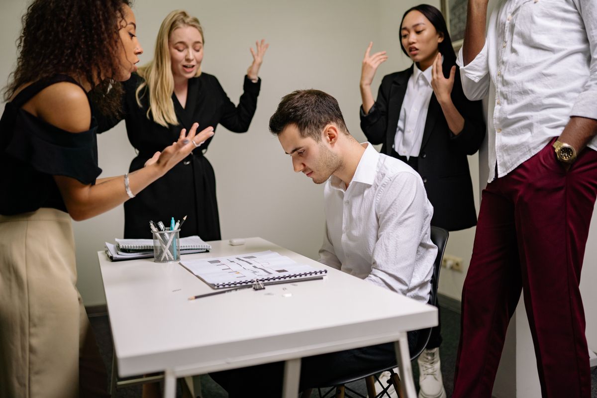 A team talking past one another in a tense meeting